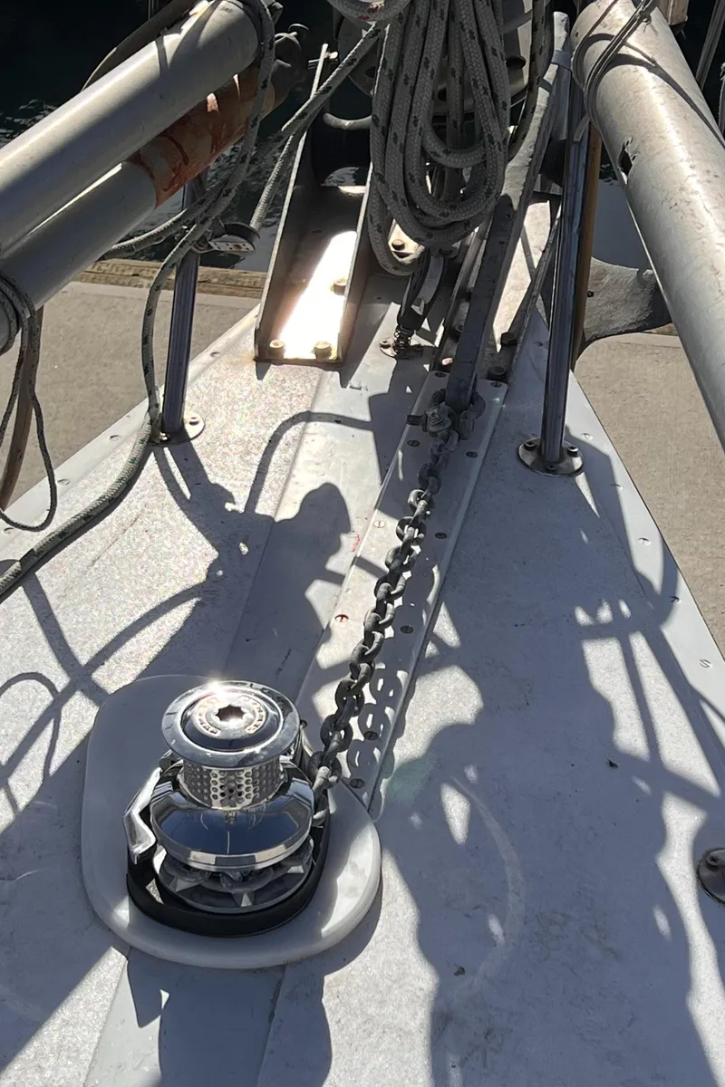 Slide: The Image of Deck of 1993 Columbia Cutter sailboat with anchor chain and winch. - 5