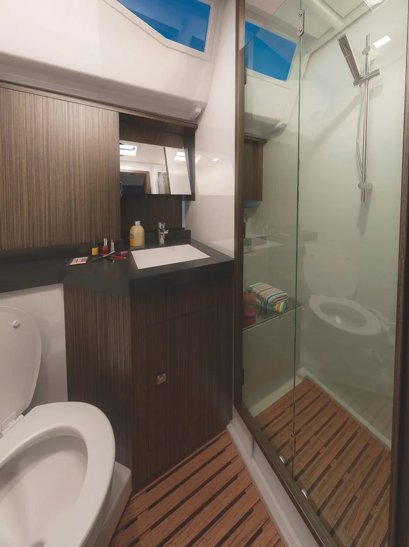 Slide: The Image of Modern bathroom in 2025 Bavaria C57 yacht with glass shower and wooden accents. - 16