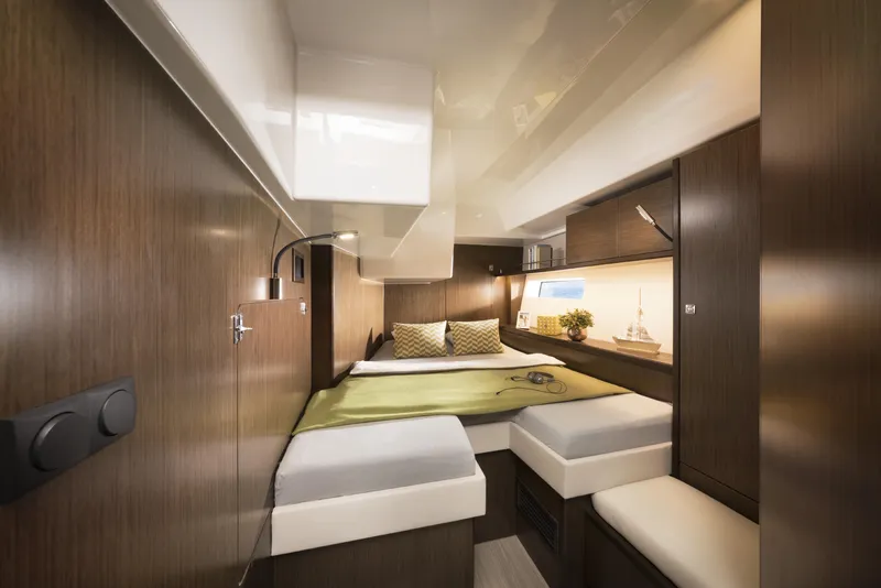 Slide: The Image of Luxurious interior cabin of 2025 Bavaria C57 yacht with modern wood finish. - 19