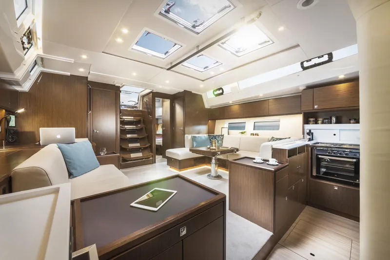 Slide: The Image of Luxurious interior of 2025 Bavaria C57 yacht, featuring modern design and elegant wood finishes. - 23