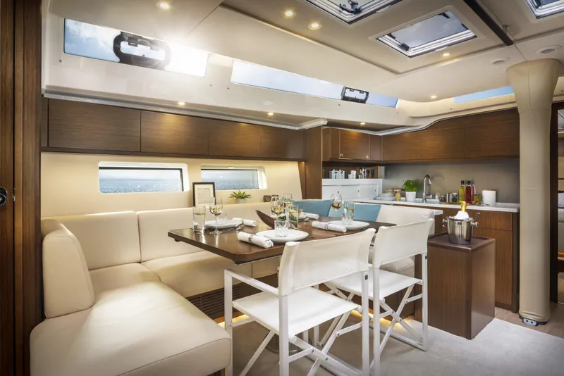 Slide: The Image of Luxurious interior of 2025 Bavaria C57 yacht with elegant dining area and modern kitchen. - 31