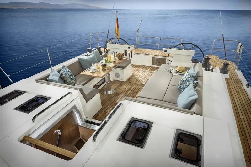 Slide: The Image of Luxurious Bavaria C57 yacht deck, 2025 model, with elegant seating and ocean view. - 37