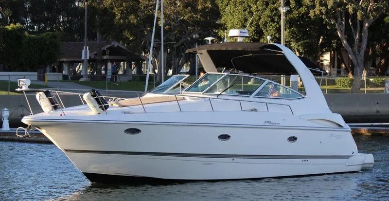 Slide: The Image of 2005 Cruisers Yachts 370 Express in a serene marina setting. - 15