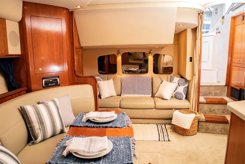 Slide: The Image of Luxurious interior of 2005 Cruisers Yachts 370 Express with elegant seating and dining area. - 9