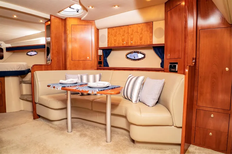 Slide: The Image of 2005 Cruisers Yachts 370 Express interior with elegant seating and dining area. - 10