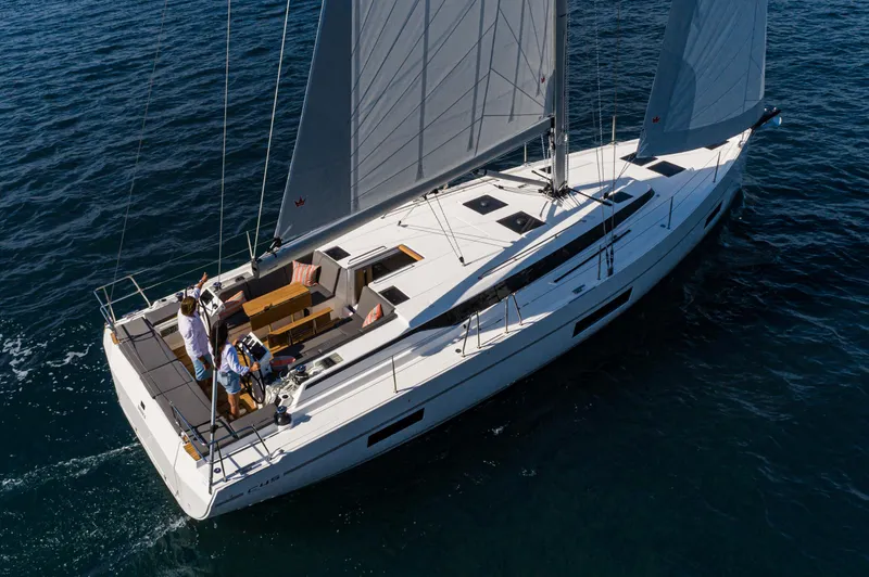 Slide: The Image of 2024 Bavaria C45 yacht sailing on open water, featuring sleek design and spacious deck. - 22