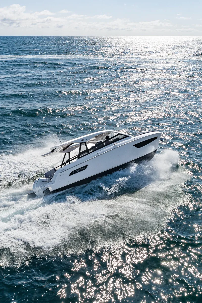 Slide: The Image of 2024 Bavaria Vida 33 cruising on open sea under clear skies. - 19