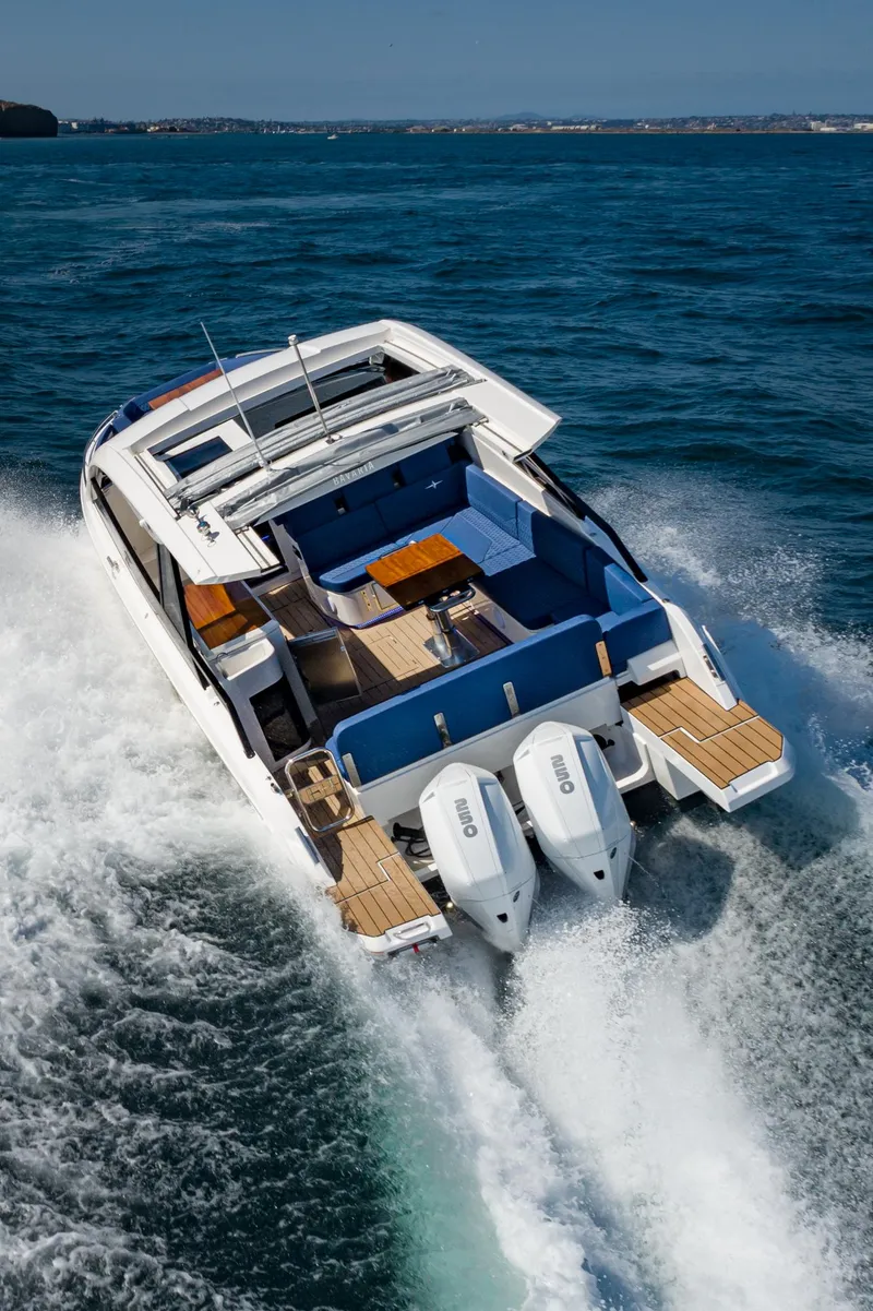 Slide: The Image of 2024 Bavaria Vida 33 yacht cruising on open water, showcasing sleek design and powerful engines. - 21