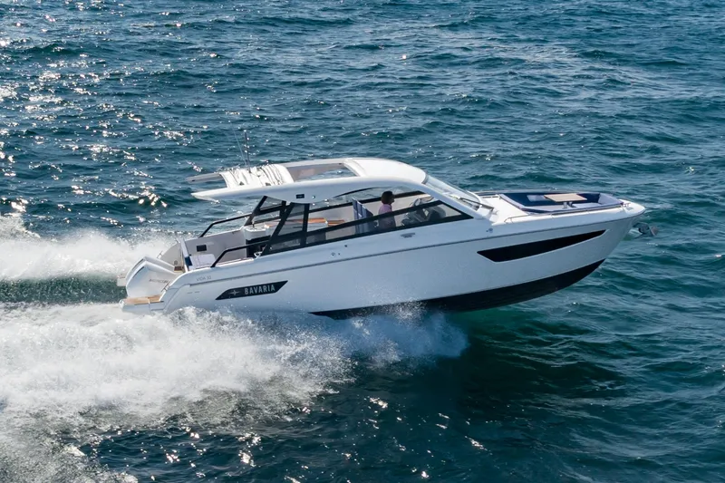 Slide: The Image of 2024 Bavaria Vida 33 motorboat cruising on open water. - 5