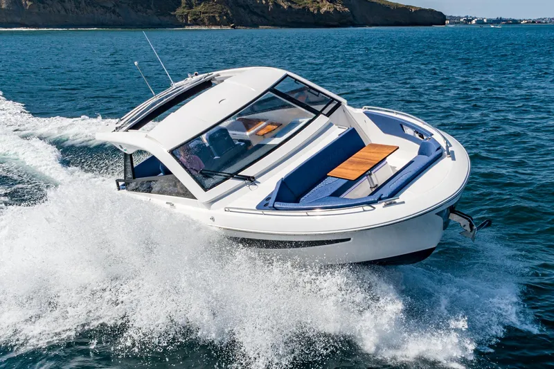 Slide: The Image of 2024 Bavaria Vida 33 cruising on open water, showcasing sleek design and performance. - 6