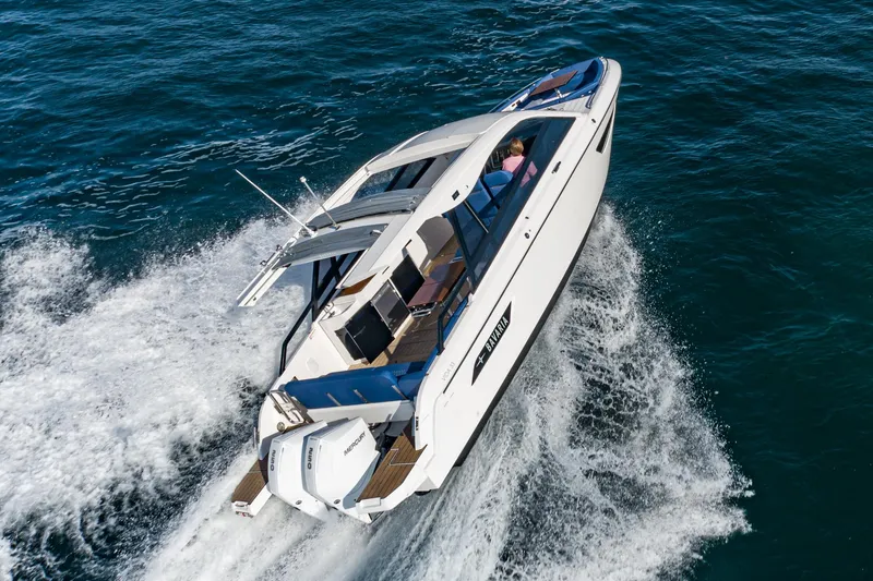 Slide: The Image of 2024 Bavaria Vida 33 motorboat cruising on open water, showcasing sleek design and powerful performance. - 9