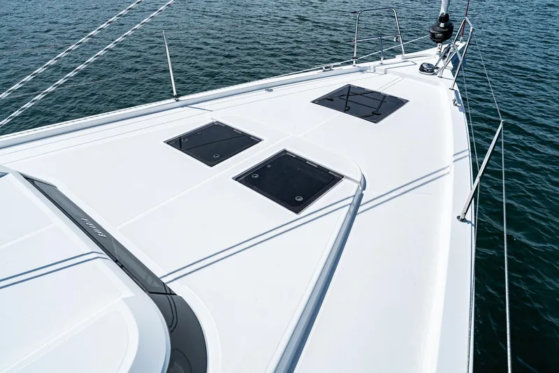 Slide: The Image of 2024 Bavaria C50 yacht deck with hatches, sailing on calm water. - 15