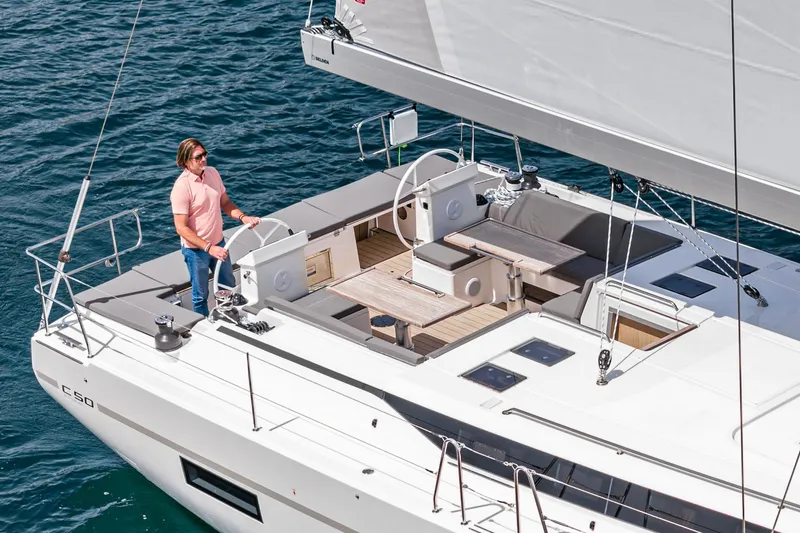Slide: The Image of 2024 Bavaria C50 yacht with person sailing on open water. - 24