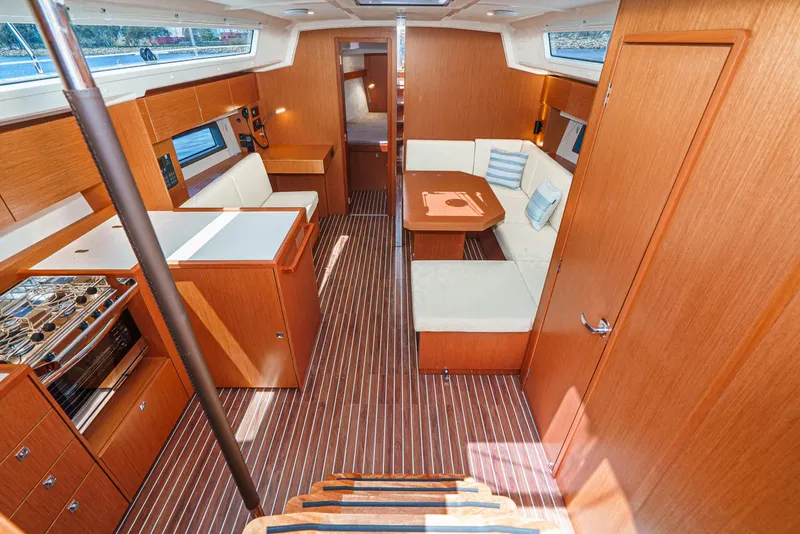 Slide: The Image of Luxurious interior of 2024 Bavaria C42 yacht with modern wood finish and comfortable seating. - 22