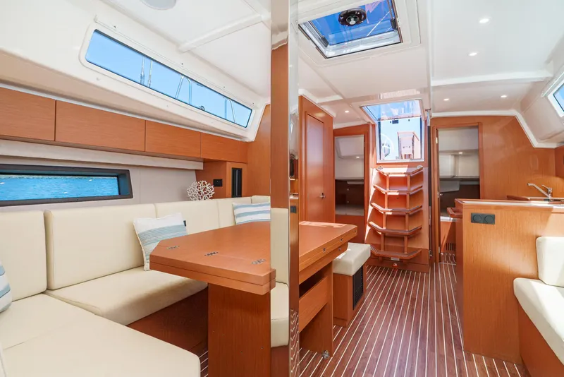 Slide: The Image of Luxurious interior of 2024 Bavaria C42 yacht with modern seating and wooden finishes. - 25