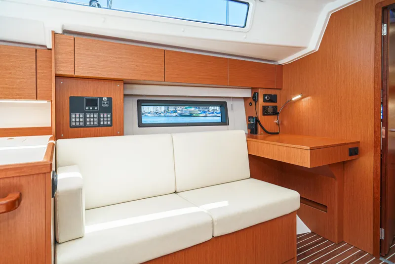 Slide: The Image of Interior of 2024 Bavaria C42 yacht with modern wood finish and comfortable seating. - 28