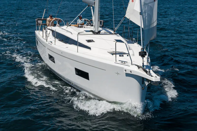Slide: The Image of 2024 Bavaria C42 sailboat cruising on open water. - 7