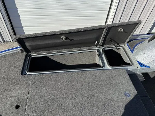 Slide: The Image of Open storage compartments on a 2015 Legend V20 boat deck. - 14