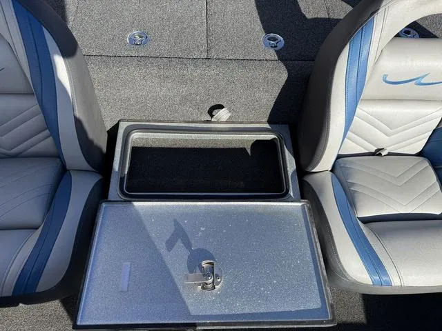 Slide: The Image of 2015 Legend V20 boat interior with open storage compartment between two seats. - 18