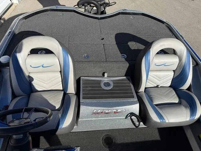 Slide: The Image of 2015 Legend V20 boat interior with two gray and blue seats. - 23
