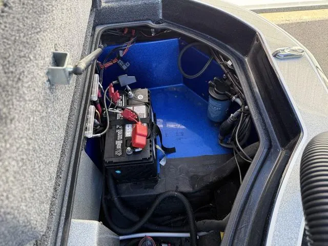 Slide: The Image of Battery compartment of a 2015 Legend V20 boat, featuring wiring and components. - 27