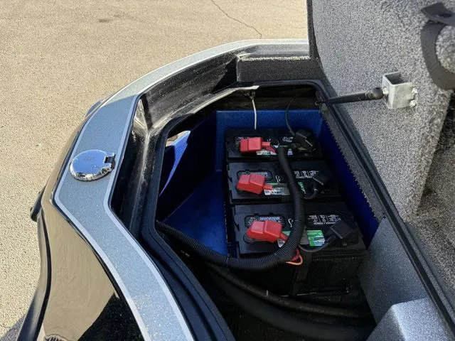 Slide: The Image of Battery compartment of a 2015 Legend V20 boat, featuring multiple batteries and wiring. - 28