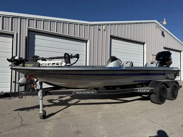 Slide: The Image of 2015 Legend V20 boat on trailer, parked outside storage units. - 5
