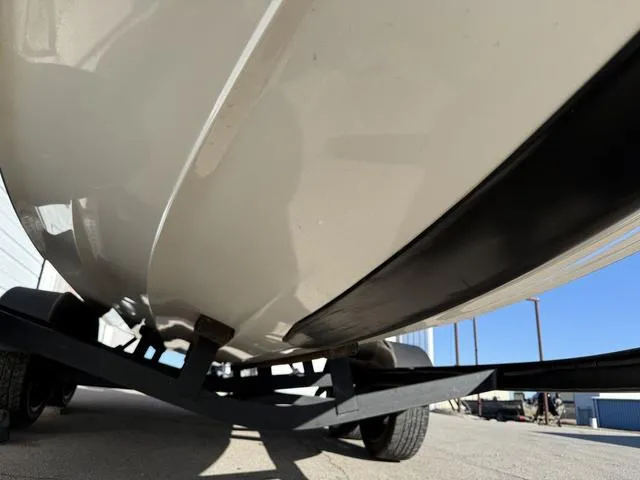 Slide: The Image of Underneath view of a 2015 Legend V20 boat on a trailer, showing hull and wheels. - 7