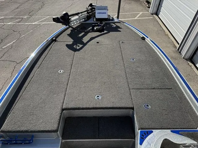 Slide: The Image of 2015 Legend V20 boat deck with trolling motor and storage compartments. - 8
