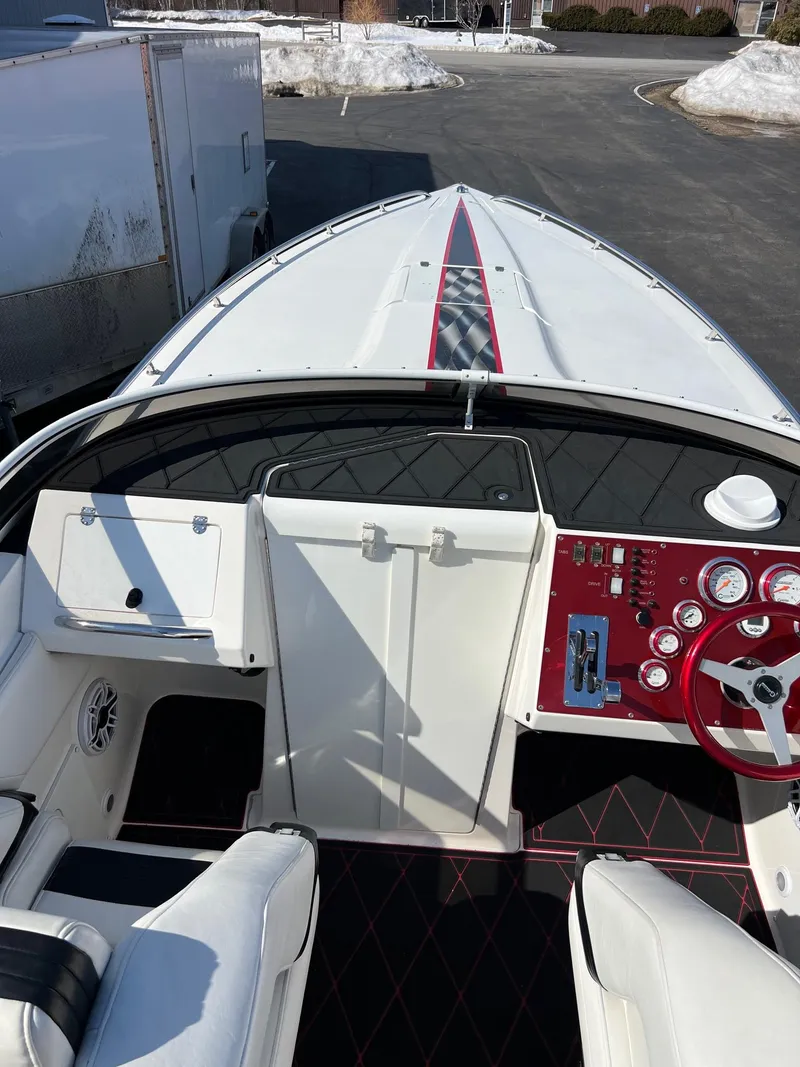 Slide: The Image of 2004 Fountain 29 Fever speedboat cockpit with red and white interior design. - 11