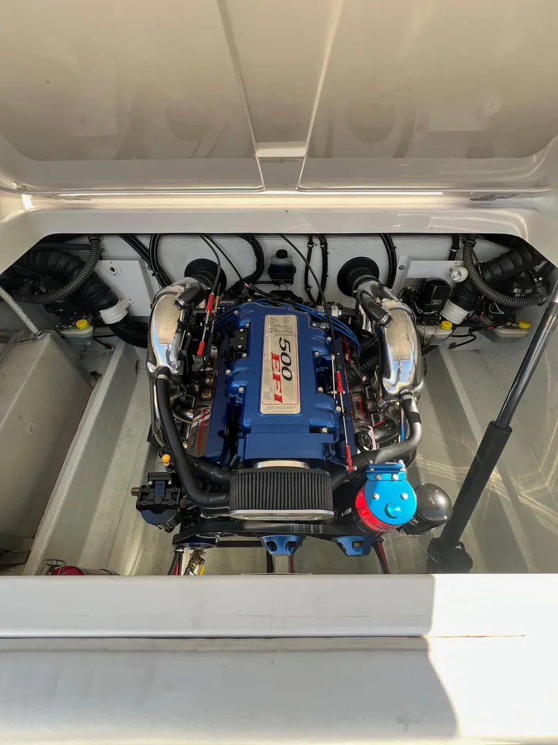 Slide: The Image of 2004 Fountain 29 Fever boat engine compartment with powerful motor. - 14