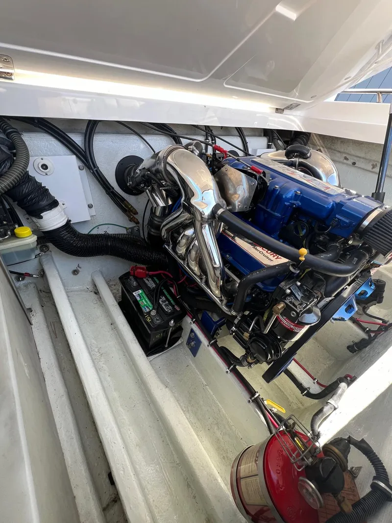 Slide: The Image of 2004 Fountain 29 Fever engine compartment with visible components and wiring. - 15