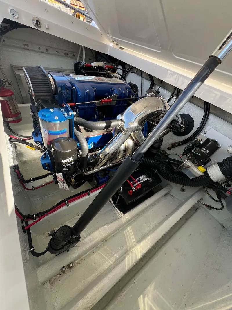 Slide: The Image of 2004 Fountain 29 Fever engine compartment with blue engine and components. - 16