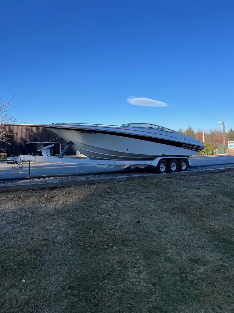 Slide: The Image of 2004 Fountain 29 Fever boat on trailer under clear blue sky. - 6