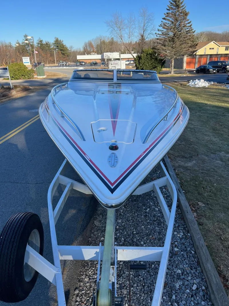Slide: The Image of 2004 Fountain 29 Fever speedboat on trailer, parked outdoors on a sunny day. - 9