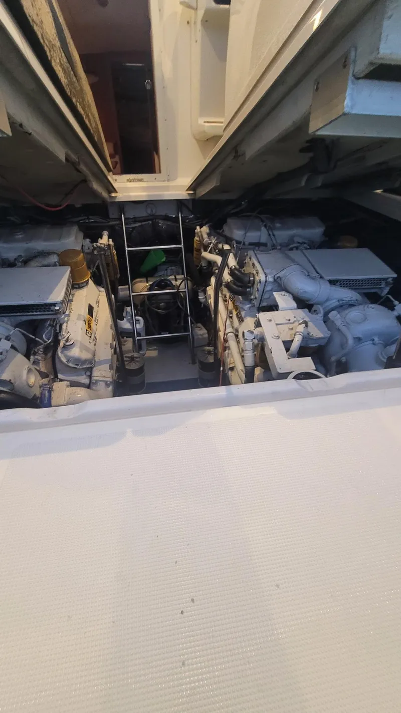 Slide: The Image of Engine compartment of a 1992 Tiara Yachts 36 Open, showcasing dual engines. - 15