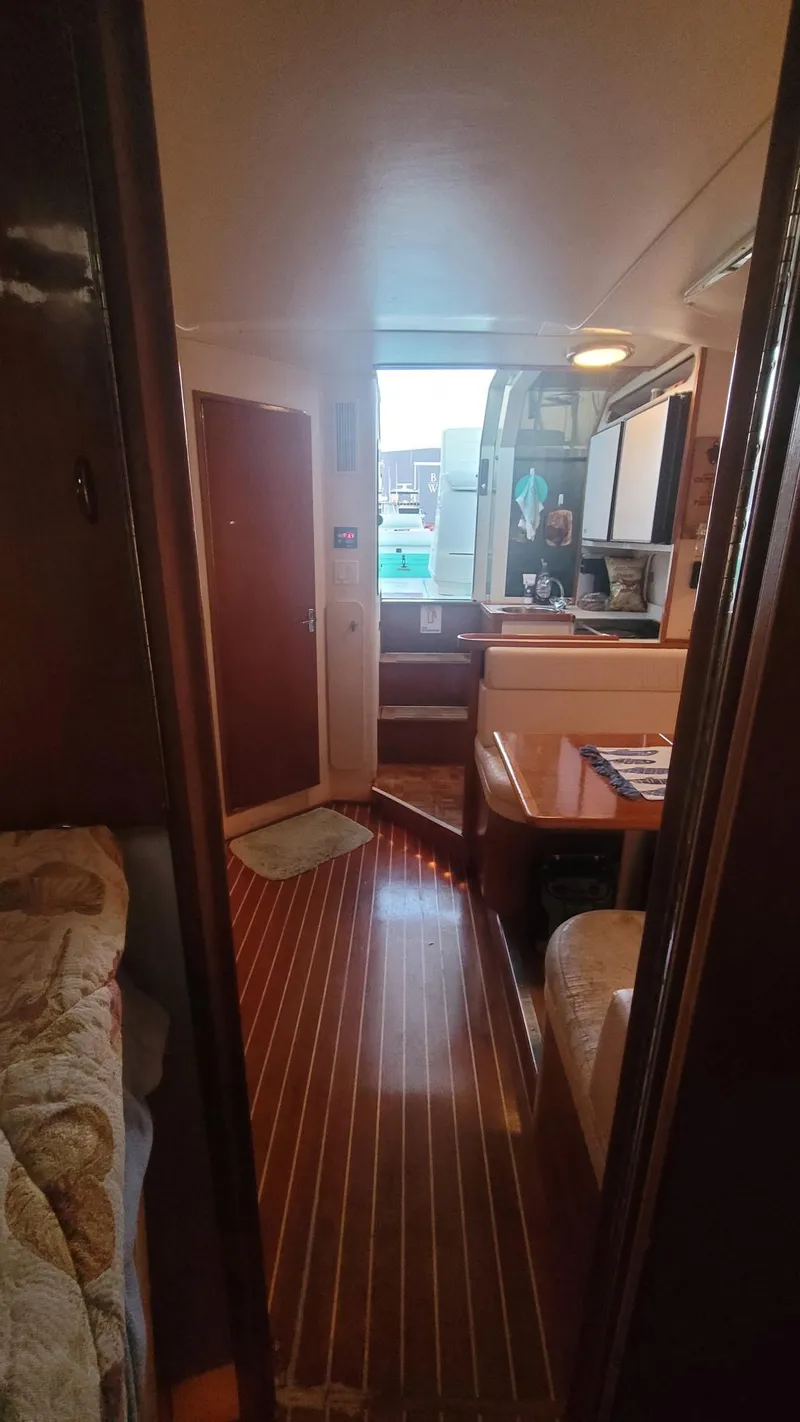 Slide: The Image of Interior view of 1992 Tiara Yachts 36 Open, featuring cozy cabin and wooden flooring. - 8
