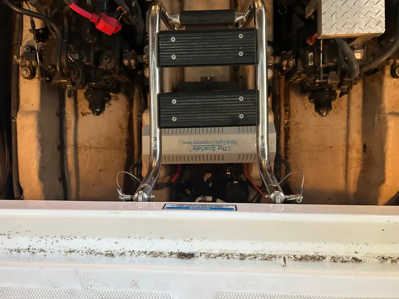 Slide: The Image of Engine compartment of 2004 Sea Ray 420 Sundancer with ladder and mechanical components. - 10