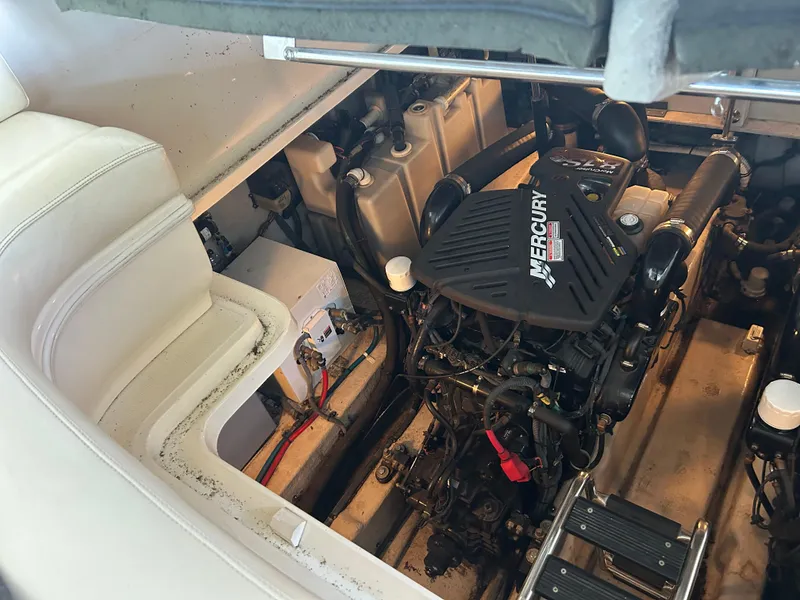 Slide: The Image of Engine compartment of a 2004 Sea Ray 420 Sundancer with Mercury engine. - 12