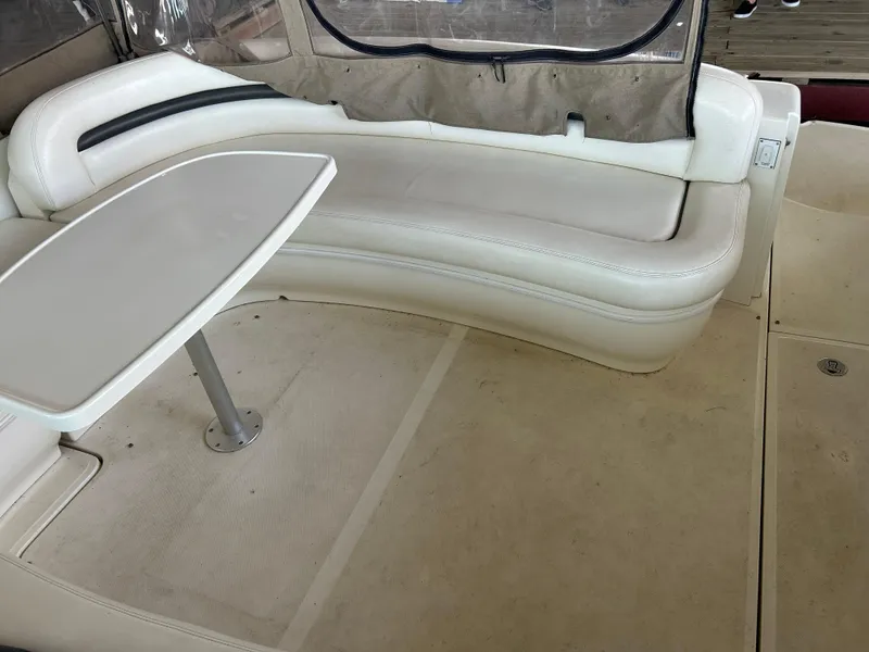Slide: The Image of 2004 Sea Ray 420 Sundancer interior with white seating and table. - 28