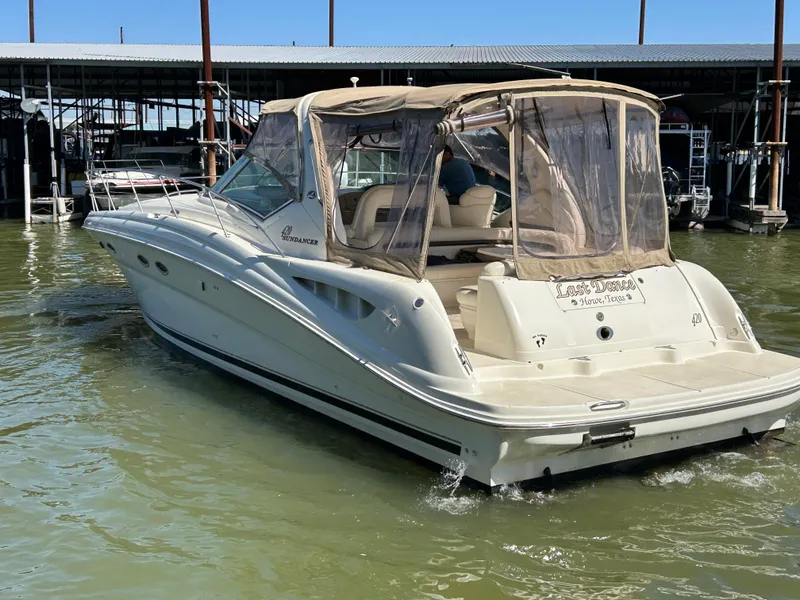 Slide: The Image of 2004 Sea Ray 420 Sundancer boat docked in marina, rear view. - 3