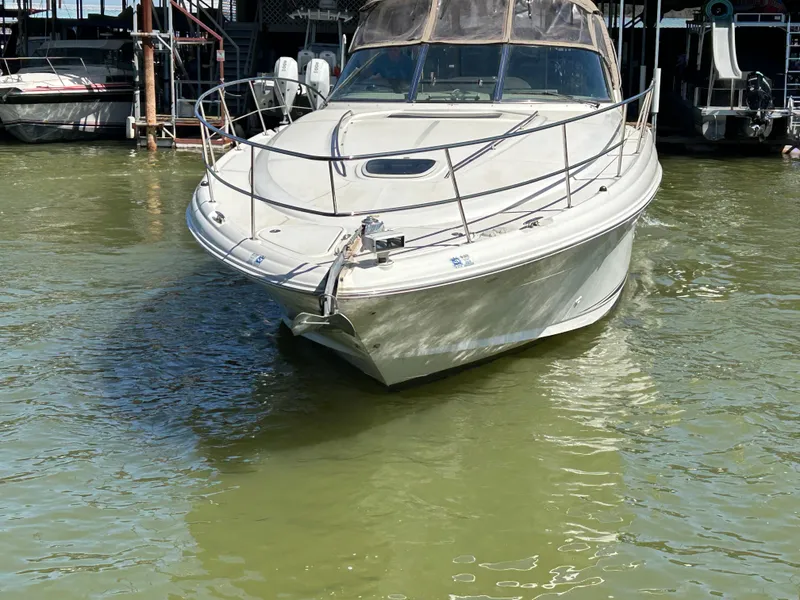 Slide: The Image of 2004 Sea Ray 420 Sundancer yacht docked in calm waters. - 5
