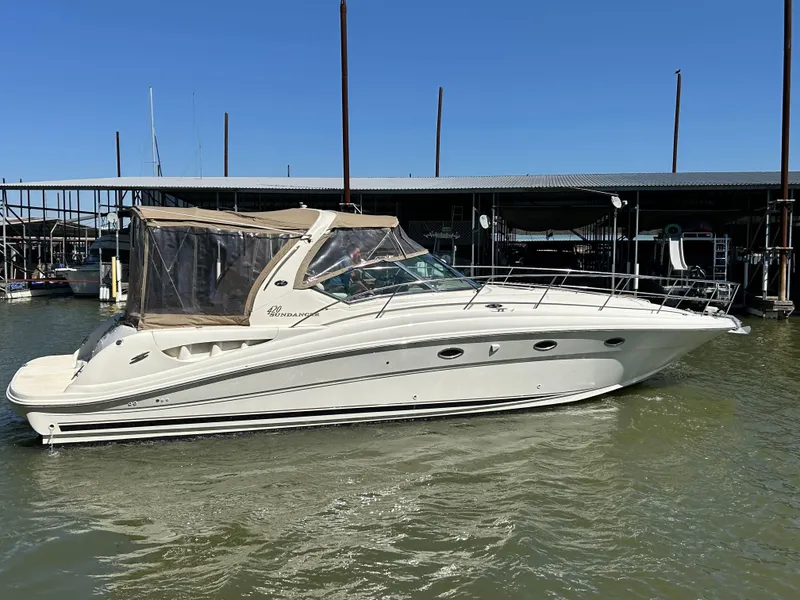Slide: The Image of 2004 Sea Ray 420 Sundancer yacht docked in marina, side view. - 8
