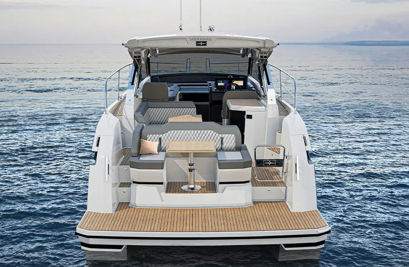 Slide: The Image of 2025 Bavaria SR33 yacht on calm ocean, showcasing luxurious deck and seating area. - 15