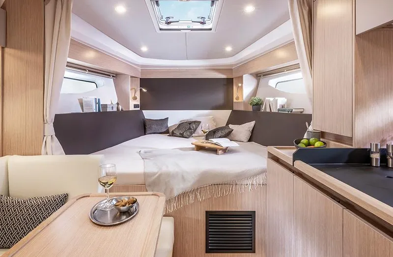 Slide: The Image of Luxurious interior of 2025 Bavaria SR33 yacht with cozy bed and elegant dining area. - 17