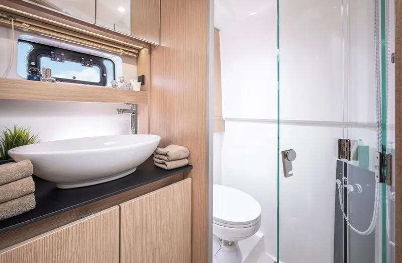 Slide: The Image of Luxurious bathroom in 2025 Bavaria SR33 yacht with modern sink and shower. - 21