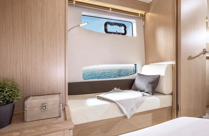 Slide: The Image of Luxurious interior of 2025 Bavaria SR33 yacht with ocean view through window. - 23