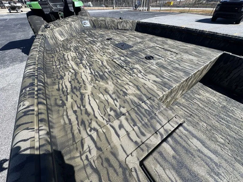 Slide: The Image of 2025 SeaArk 1752 Slayer Pro boat with camouflage pattern on deck. - 12