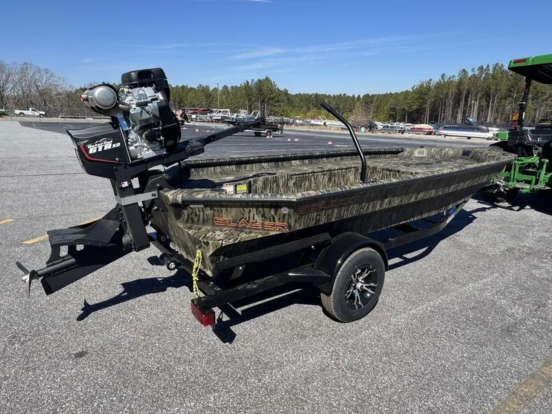 Slide: The Image of 2025 SeaArk 1752 Slayer Pro boat on trailer in parking lot. - 7
