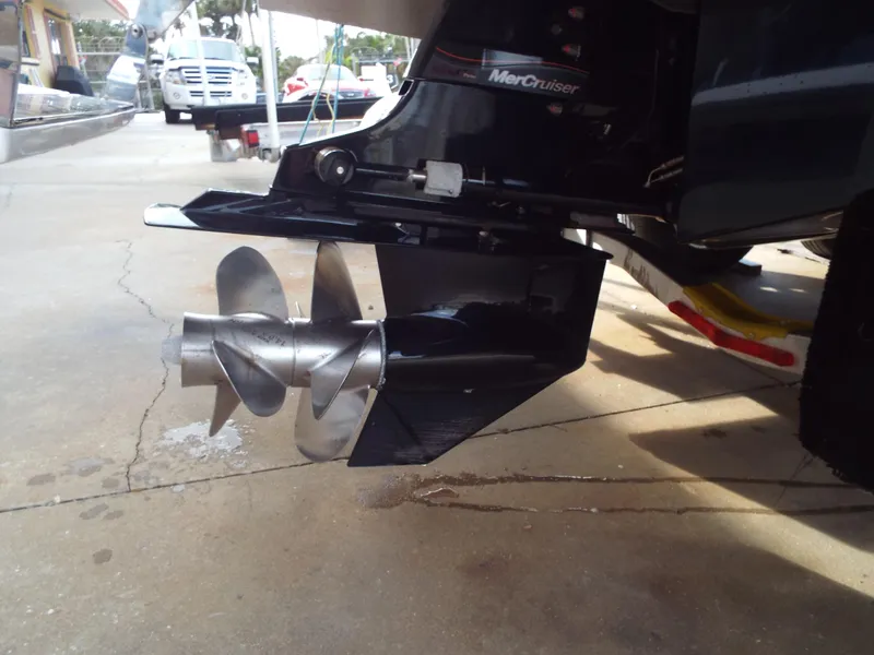 Slide: The Image of 2021 Cobalt CS22 boat with MerCruiser propeller on a concrete surface. - 10